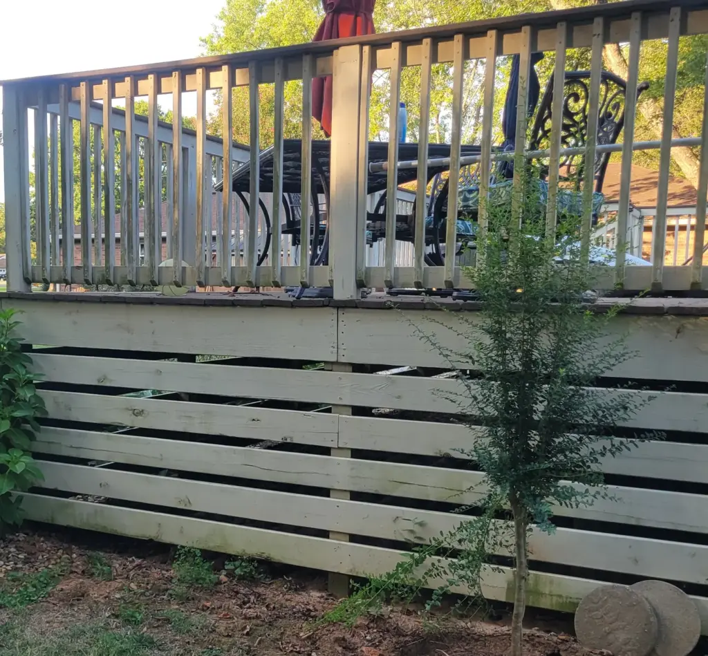 After: the same backyard deck cleared of junk