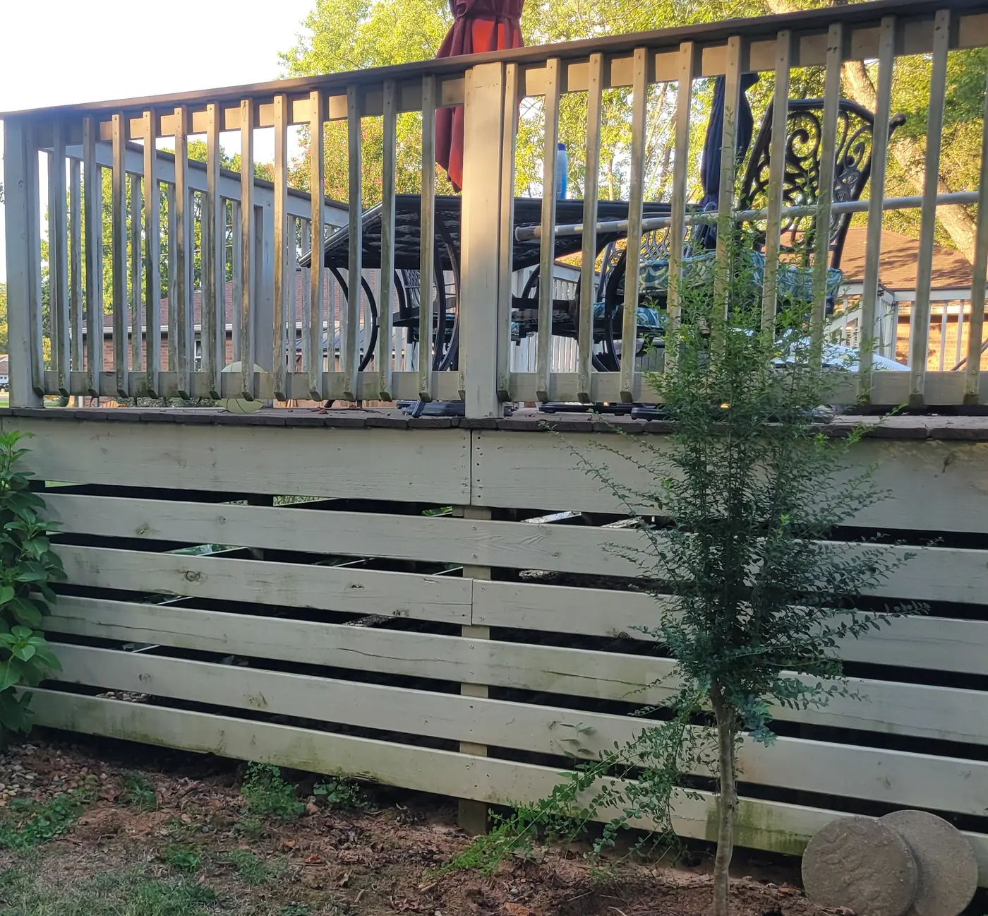 After: the same backyard deck cleared of junk