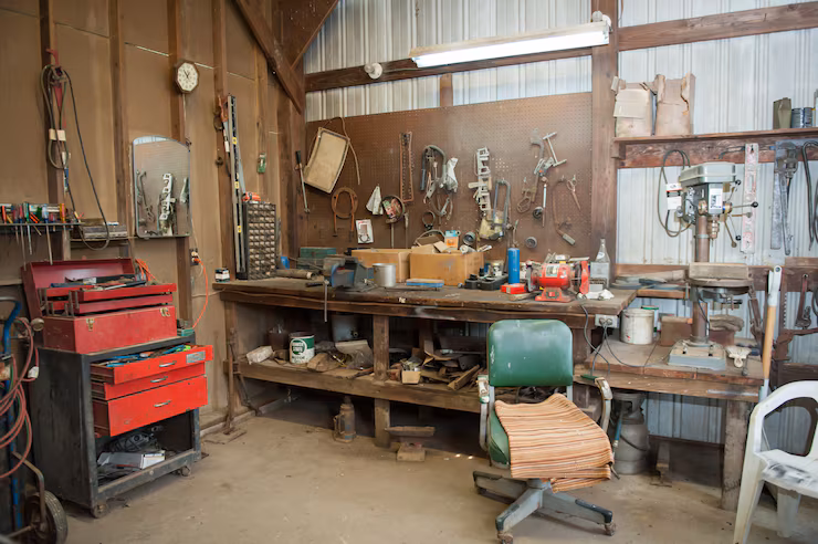Cluttered barn workbench and tools cleared during a Murfreesboro TN garage cleanout