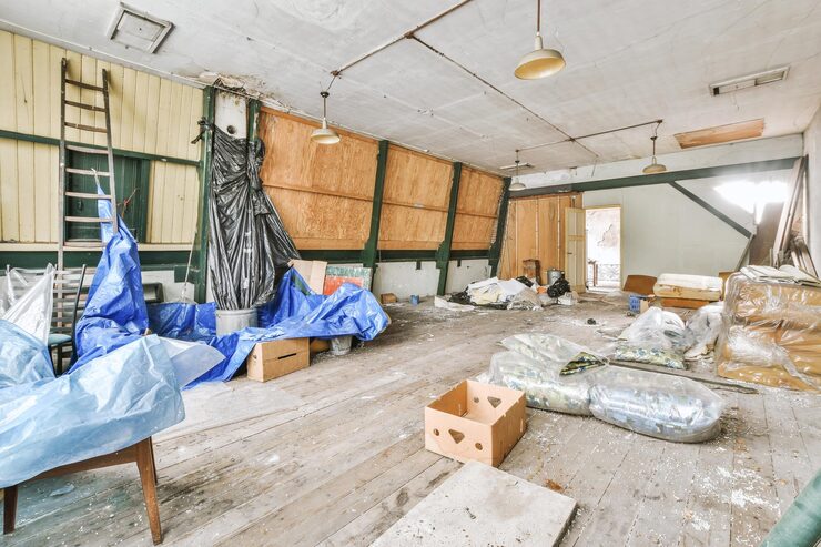 Cluttered room with leftover debris and equipment during a property management cleanout in Murfreesboro TN
